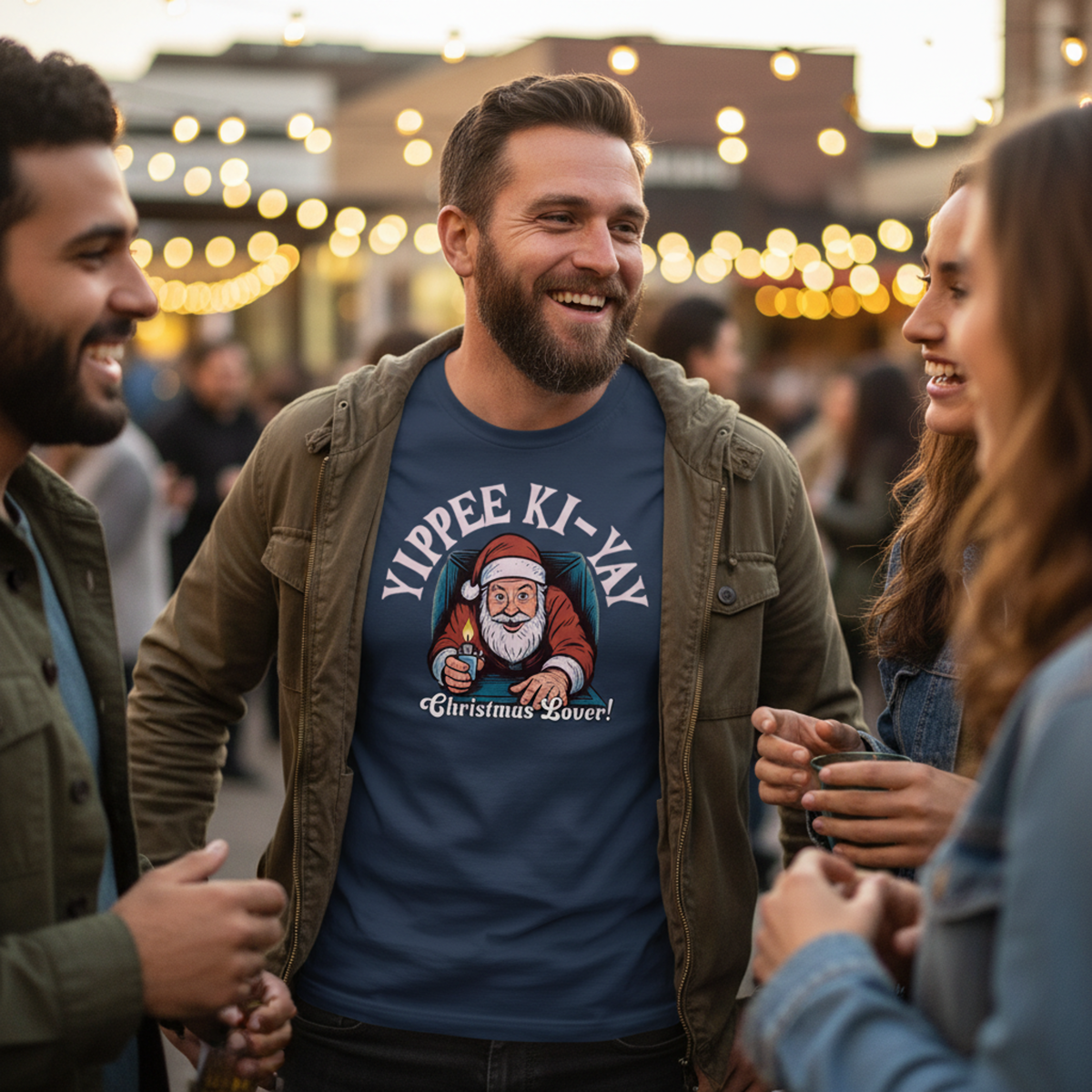 Man wearing a santa shirt with a group of friends.